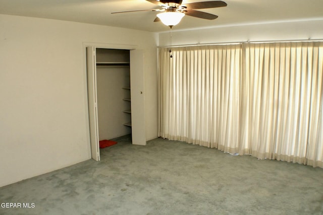 unfurnished bedroom featuring light carpet and ceiling fan