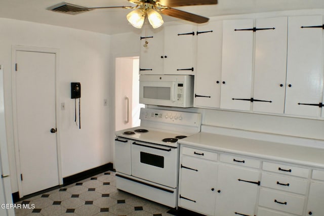 kitchen featuring ceiling fan, white cabinetry, and white appliances