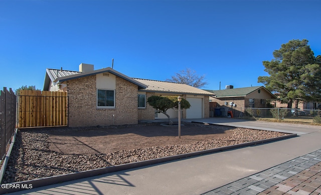 single story home featuring a garage