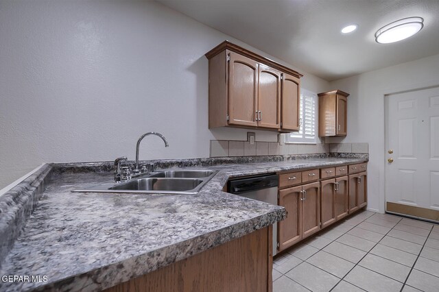 kitchen featuring light tile patterned flooring and sink