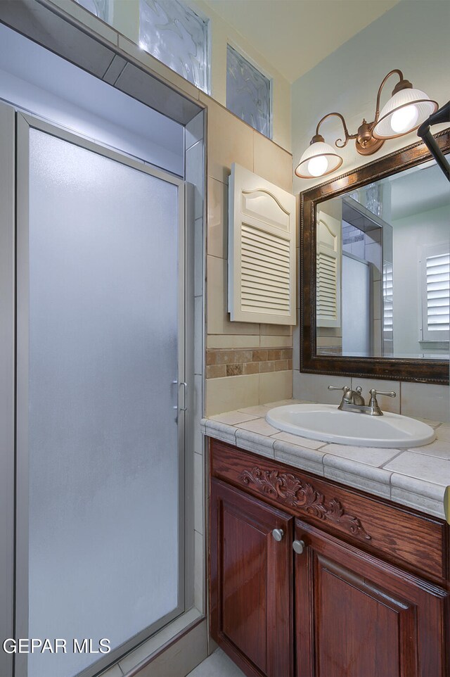 bathroom with backsplash and vanity