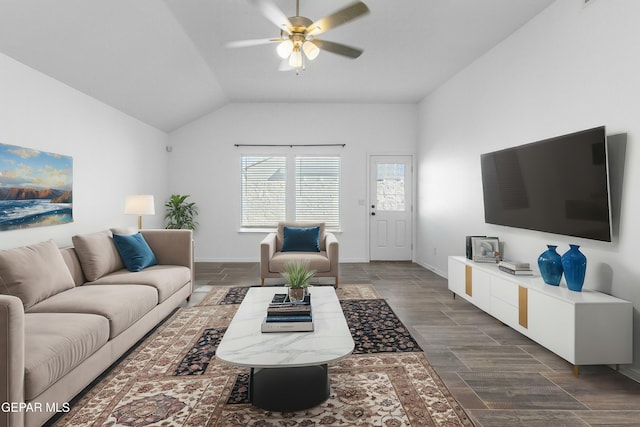 living room featuring ceiling fan and lofted ceiling