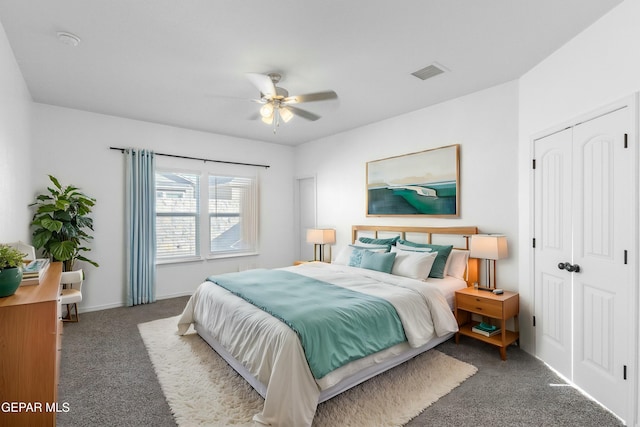 carpeted bedroom with a closet and ceiling fan