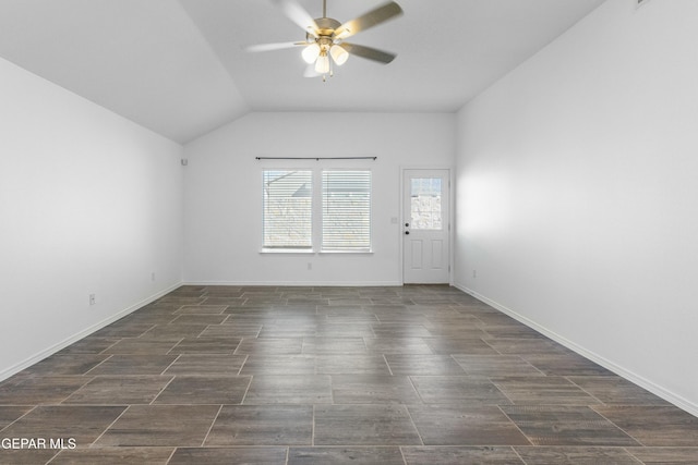 spare room with vaulted ceiling and ceiling fan