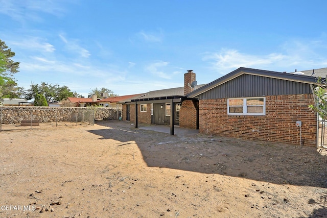 rear view of house featuring a patio area