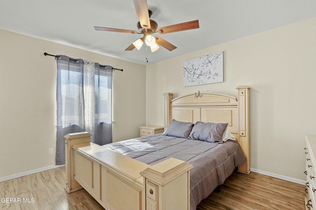 bedroom featuring ceiling fan and light hardwood / wood-style flooring