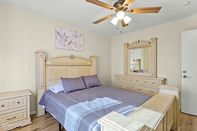 bedroom featuring light wood-type flooring and ceiling fan