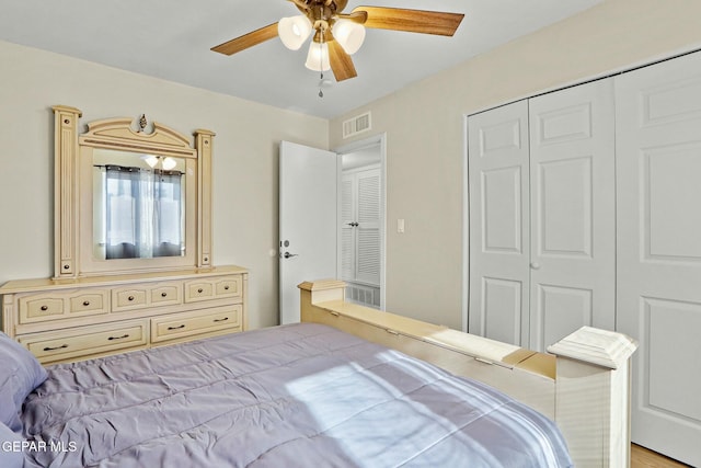 bedroom featuring ceiling fan, a closet, and light hardwood / wood-style flooring