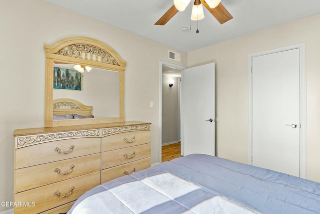 bedroom featuring wood-type flooring and ceiling fan