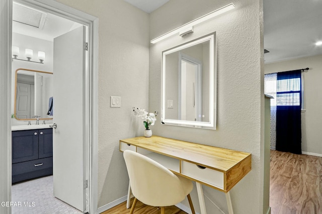 bathroom featuring vanity and wood-type flooring