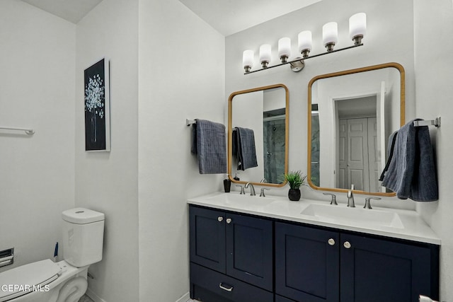 bathroom with vanity, an enclosed shower, and toilet