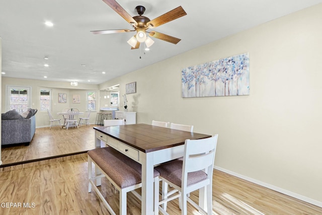 dining area featuring ceiling fan and light hardwood / wood-style floors