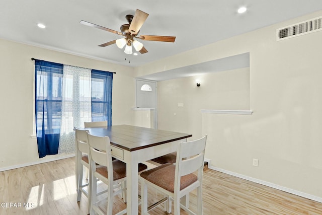 dining space featuring ceiling fan and light hardwood / wood-style floors