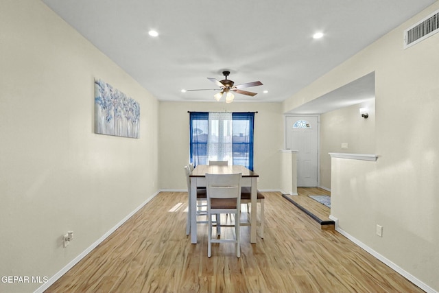 dining area featuring ceiling fan and light hardwood / wood-style flooring