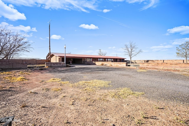 view of front of property with a rural view