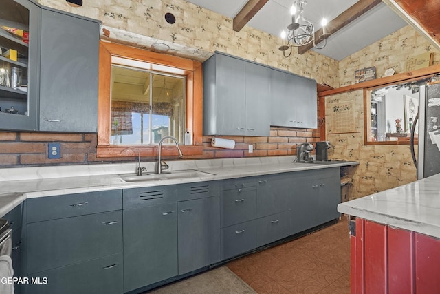 525 N Main St, Dell City, TX 79837 - kitchen featuring gray cabinets, a chandelier, and beam ceiling