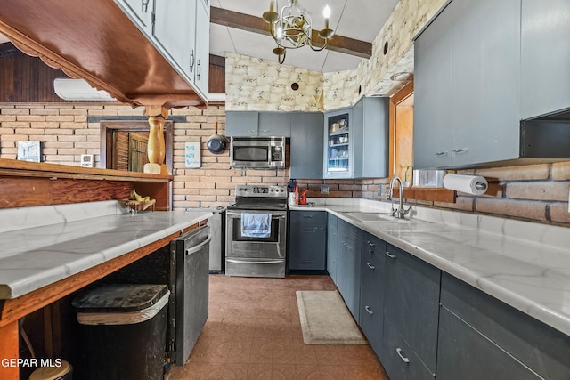 525 N Main St, Dell City, TX 79837 - kitchen featuring appliances with stainless steel finishes, light countertops, tile patterned floors, and glass insert cabinets