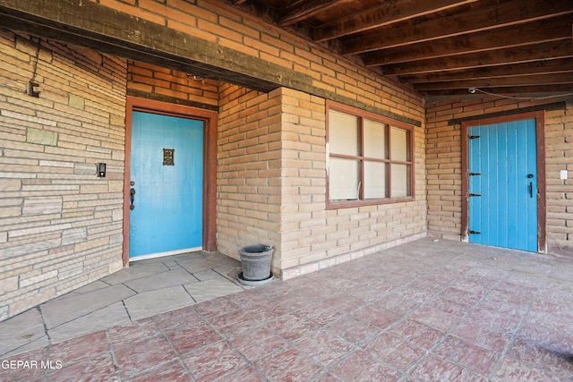 property entrance with a patio area