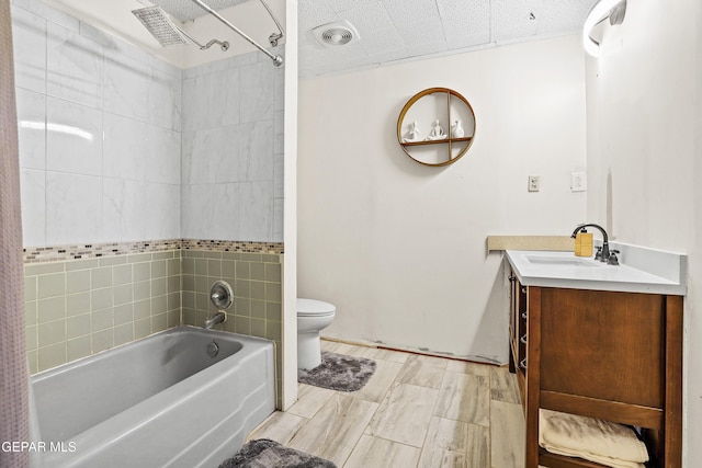 full bathroom with shower / bathing tub combination, vanity, and toilet