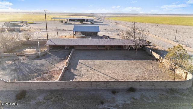 birds eye view of property featuring a rural view