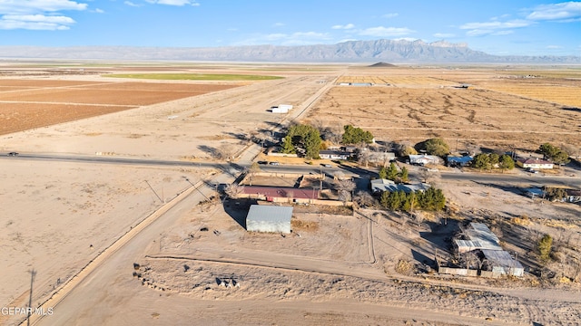 525 N Main St, Dell City, TX 79837 - aerial overview of property's location with rural landscape and a mountainous background