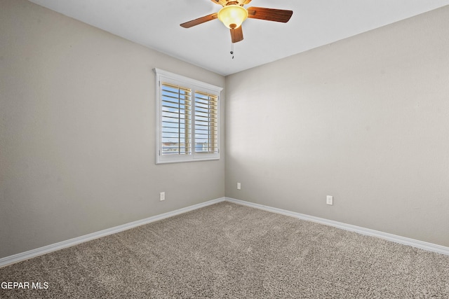 spare room with carpet floors and ceiling fan