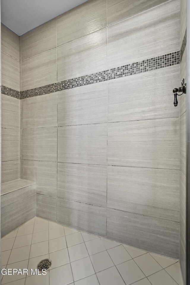 bathroom with a tile shower