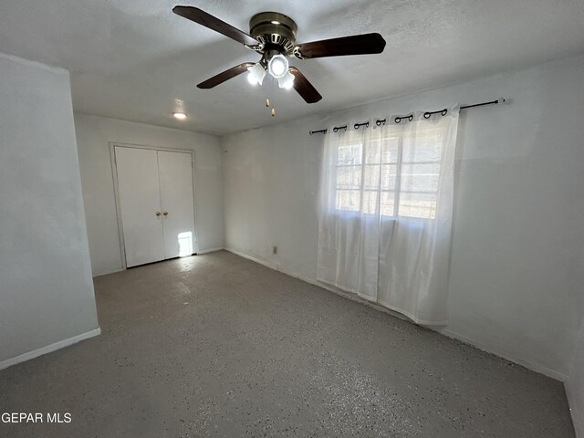 unfurnished room featuring a textured ceiling