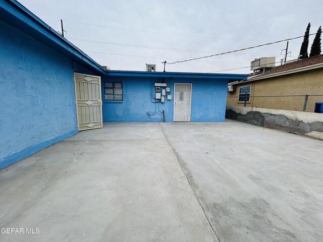 exterior space featuring central AC and a patio area