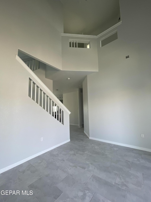 12498 Paseo Azul Dr, El Paso, TX 79928 - interior space with a high ceiling, baseboards, and stairway
