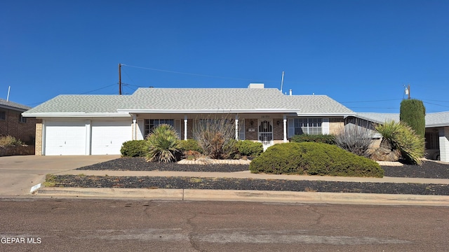 single story home featuring a garage