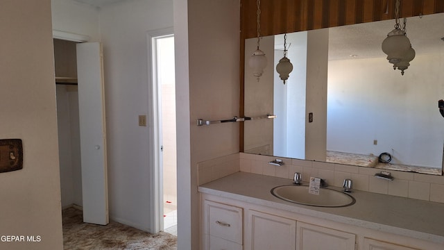 bathroom with vanity and backsplash