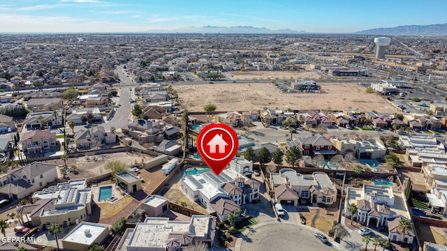 birds eye view of property featuring a mountain view