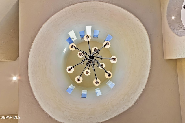 interior details featuring a notable chandelier