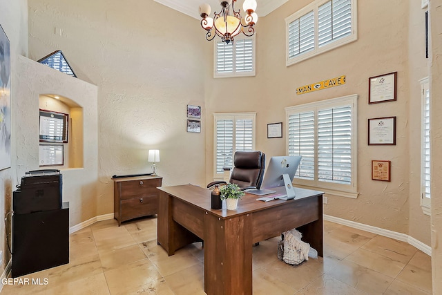 tiled office space featuring a high ceiling and an inviting chandelier