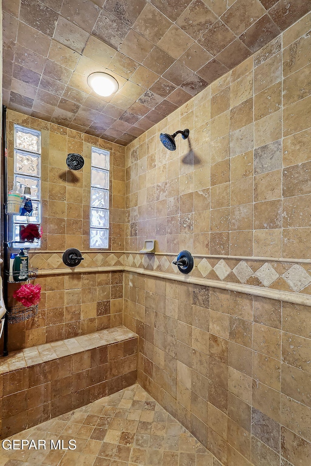 bathroom featuring tiled shower