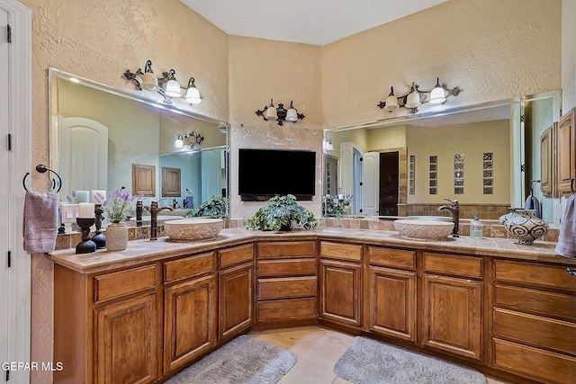 bathroom with vanity and tile patterned floors