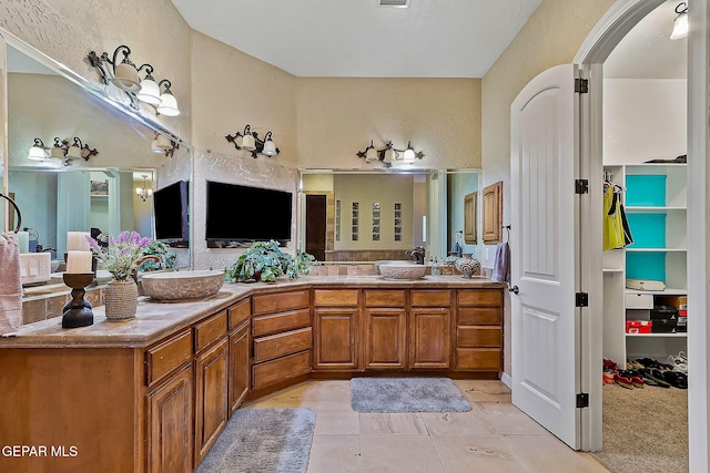 bathroom with tile patterned flooring and vanity