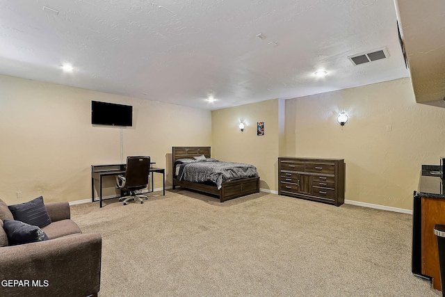 bedroom with light colored carpet