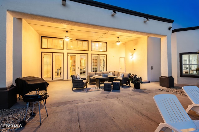 view of patio / terrace with ceiling fan, area for grilling, and an outdoor living space