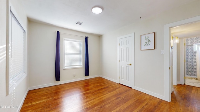 unfurnished bedroom featuring hardwood / wood-style floors