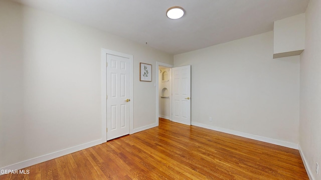 empty room featuring hardwood / wood-style flooring