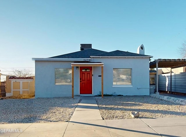 view of front of property featuring a carport