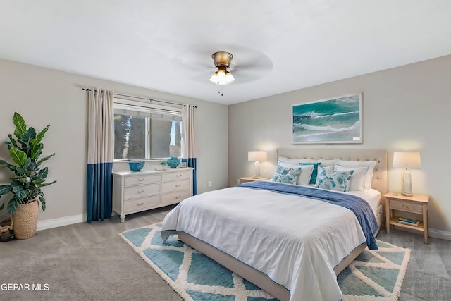 bedroom with ceiling fan and light carpet