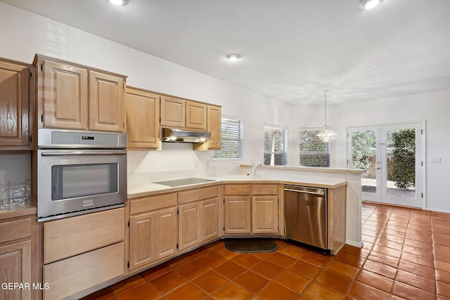 kitchen featuring dark tile patterned flooring, light brown cabinets, sink, and stainless steel appliances