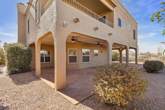 exterior space with a patio area and ceiling fan