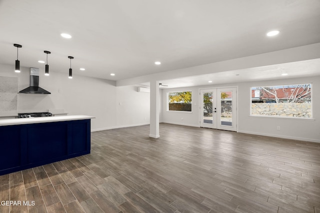 bar with recessed lighting, french doors, wall chimney range hood, and dark wood-style flooring