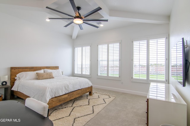 bedroom featuring beam ceiling, light colored carpet, and ceiling fan