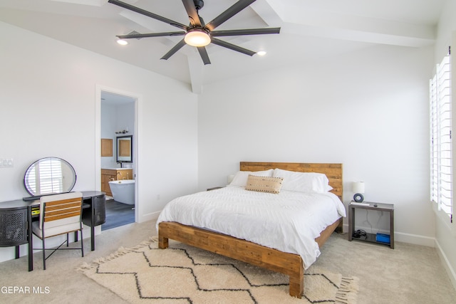 carpeted bedroom featuring beamed ceiling, ensuite bathroom, ceiling fan, and multiple windows