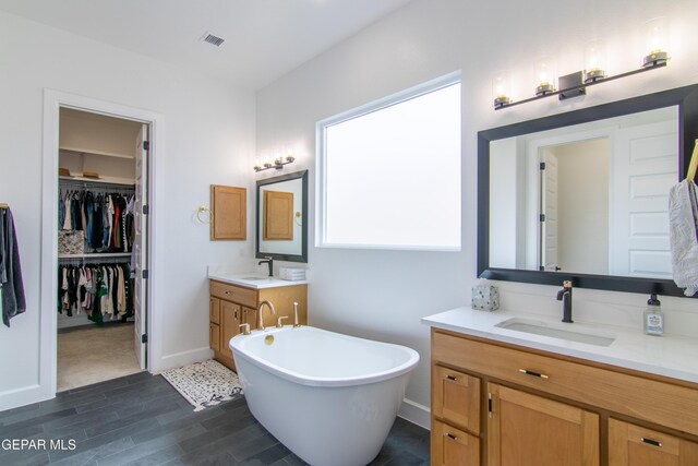 bathroom featuring a bathtub and vanity